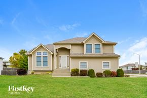 Kansas City house for rent - A house with a lawn in front of it.