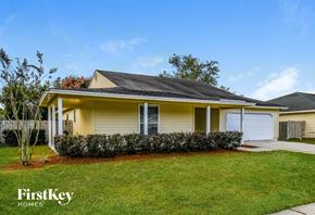 Jacksonville house for rent - A house with a well-maintained lawn and a clear sky.