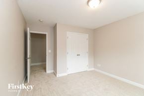 Greensboro house for rent - a bedroom with a closet and a door to the bathroom