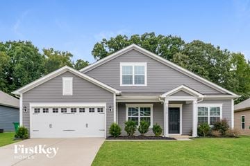 Charlotte house for rent - a gray house with a white garage door