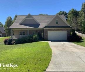 Clermont house for rent - a house with a driveway and a garage door