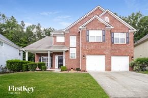Lithia Springs house for rent - a brick house with two white garage doors