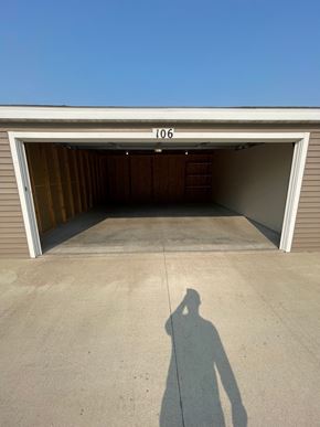 Fargo apartment for rent - a shadow of a person standing in front of a garage door