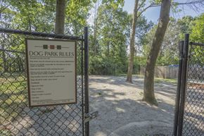 Fairfax townhouse for rent - A sign that says Dog Park Rules is posted on a fence.