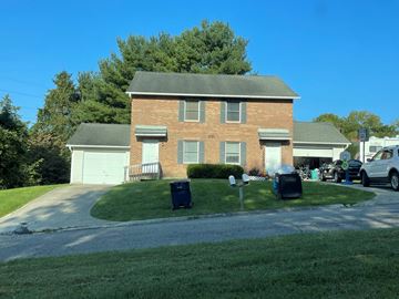 Newark apartment for rent - A house with a garage and a driveway.