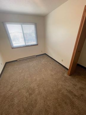 Fargo apartment for rent - an empty room with carpet and a window