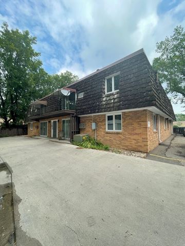 Fargo apartment for rent - the front of a brick house with a parking lot