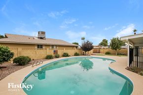 Phoenix house for rent - a large pool in the backyard of a house