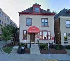 Pittsburgh apartment for rent - a white building with a red sign in front of it