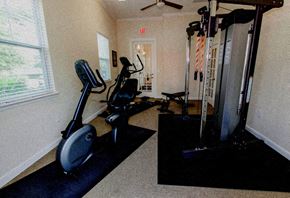 Lady Lake apartment for rent - a gym with exercise equipment in a room with a window