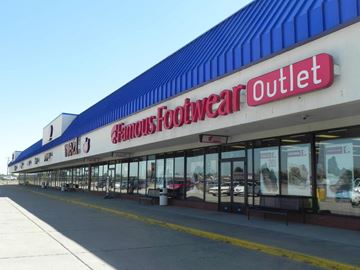 Sikestonn(Minor) apartment for rent - the outside of a roundabout outlet store with cars in the window