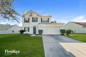 Goose Creek house for rent - a white house with a driveway and a lawn