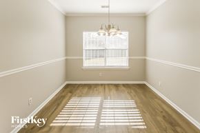 Goose Creek house for rent - an empty dining room with wood floors and a window