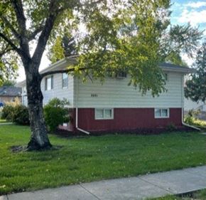 Fargo apartment for rent - a white and with a tree in front of it