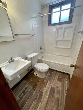 Fargo apartment for rent - a bathroom with a toilet and a sink and a bath tub