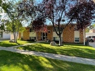 Fargo apartment for rent - a brick building with trees in front of it