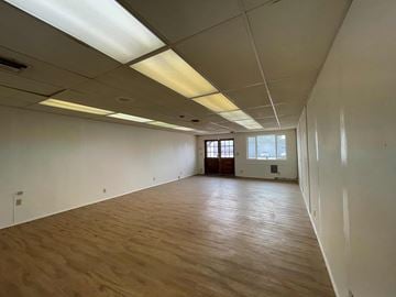 Hayfork apartment for rent - A large empty room with wooden floors and white walls.