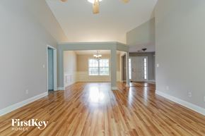 Loganville house for rent - the living room and dining room of an empty house