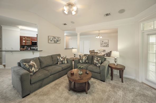 Columbus apartment for rent - A living room with a grey couch and a coffee table.