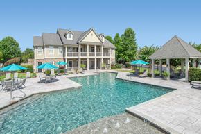 Columbus apartment for rent - A large house with a pool in the backyard.