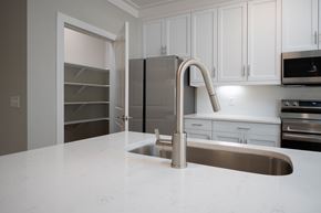 Columbus apartment for rent - A kitchen with a sink and a refrigerator.