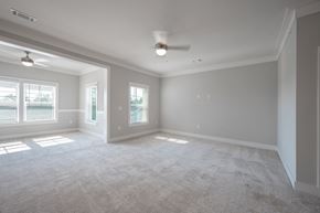 Columbus apartment for rent - A spacious room with a carpeted floor and a ceiling fan.
