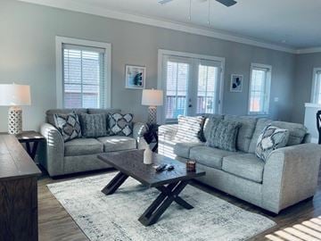 Columbus apartment for rent - A living room with two grey couches and a coffee table.