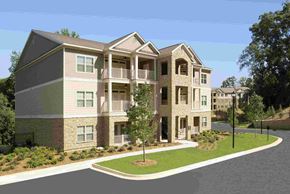 Columbus apartment for rent - A modern two-story apartment building with a balcony on the second floor.