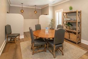 Columbus apartment for rent - A dining room with a wooden table and chairs.