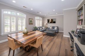 Columbus apartment for rent - A modern dining room with a wooden table and chairs.