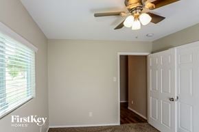 San Antonio house for rent - a bedroom with a ceiling fan and a door to a closet