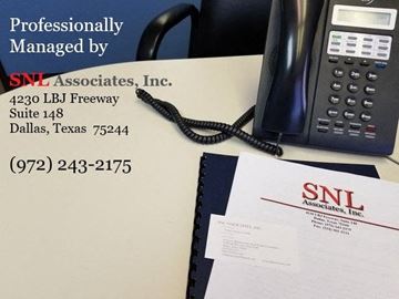Roanoke condo for rent - a desk with a telephone and a piece of paper