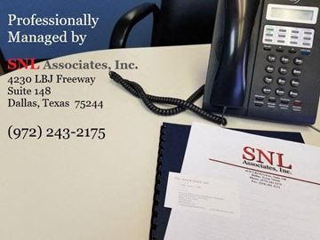 Dallas condo for rent - a desk with a telephone and a piece of paper