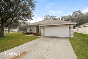 Port Orange house for rent - a home with a driveway and a garage door