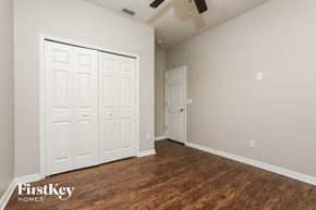 Port Orange house for rent - a bedroom with two closets and a wood floor
