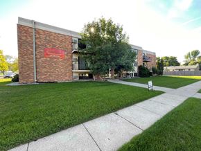 West Fargo apartment for rent - a sidewalk in front of a brick building