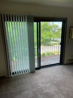 West Fargo apartment for rent - a living room with a sliding glass door