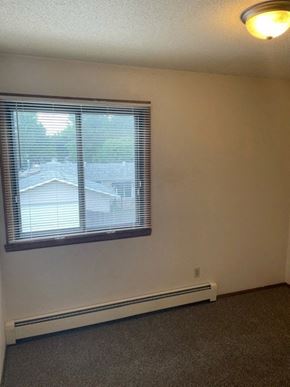 West Fargo apartment for rent - an empty room with a window and a lamp