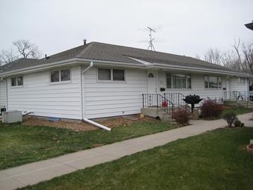 Kearney apartment for rent - a white house with a sidewalk in front of it