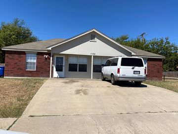 Copperas Cove apartment for rent - a white van parked in front of a brick house