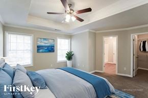 Jefferson house for rent - A bedroom with a bed, a ceiling fan, and a painting on the wall.