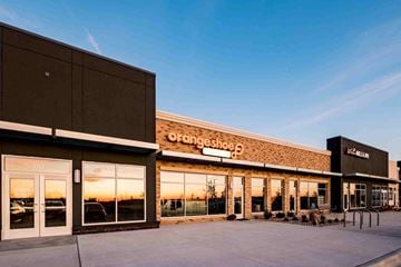 Sun Prairie apartment for rent - The exterior of a Fangshoe store with a clear sky in the background.