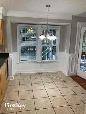 Woodstock house for rent - a kitchen with a large window and a tiled floor
