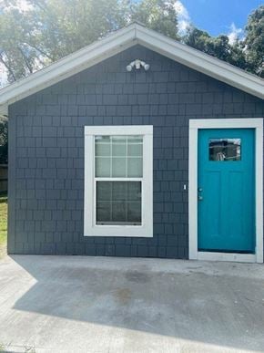 Winter Park apartment for rent - a blue house with a blue door and a window