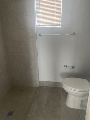 Winter Park apartment for rent - a small bathroom with a toilet and a window