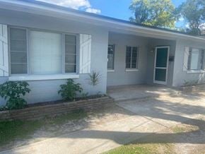 Winter Park apartment for rent - a white house with a walkway in front of it