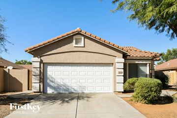 San Tan Valley house for rent - a house with a white garage door in front of it