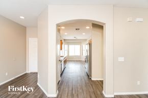 San Tan Valley house for rent - a renovated kitchen and living room with wood floors and white walls