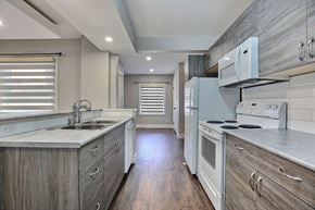 Regina apartment for rent - A kitchen with a sink, stove, and oven.