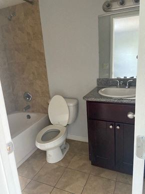 Orlando apartment for rent - a bathroom with a toilet and a sink and a bath tub